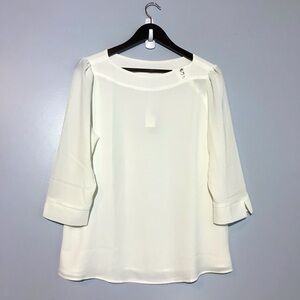 NWT. Reitmans White Blouse with Button detail on Collar.